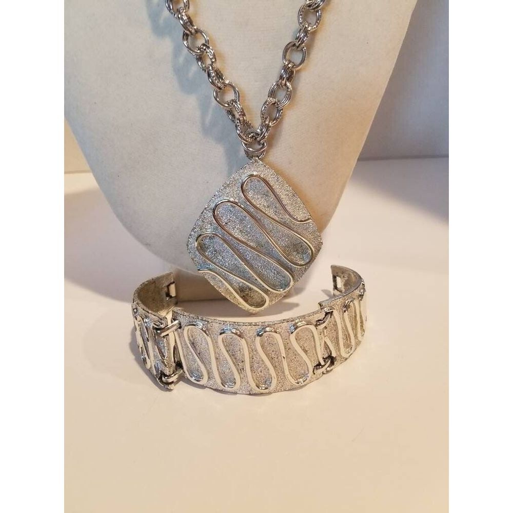 Sarah Coventry necklace/ brooch and bracelet. Silver tone